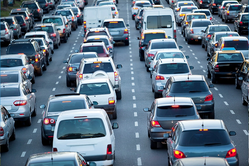 Traffic congestion on a multilane highway with various cars during rush hour