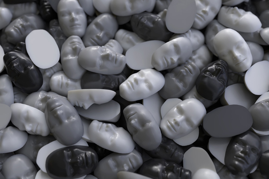 assortment of black, grey and white masked faces that look like piles of stones