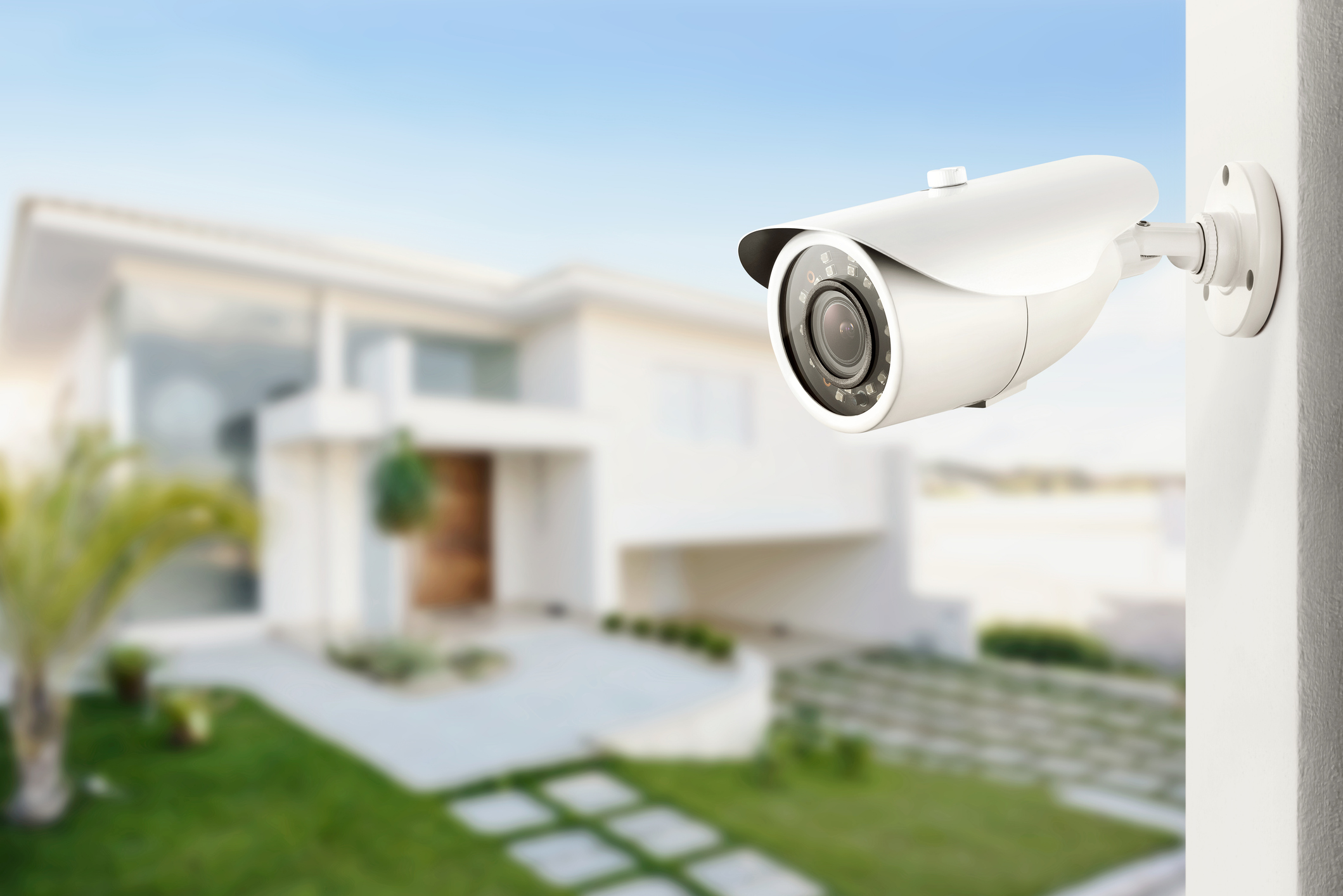 A security camera looks over a house for a home security system